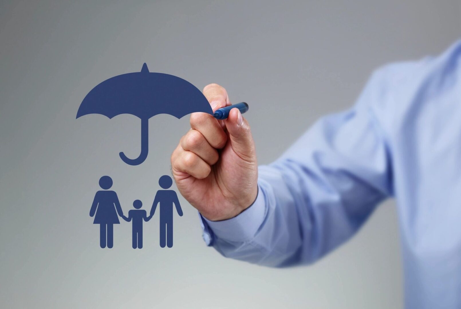 A person drawing an umbrella over their family.